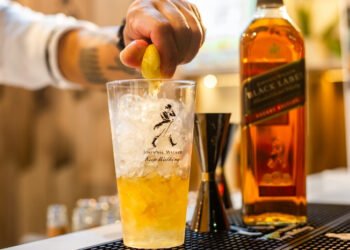 How Has Johnnie Walker Successfully Positioned Itself as a Global Icon in the World of Whisky?