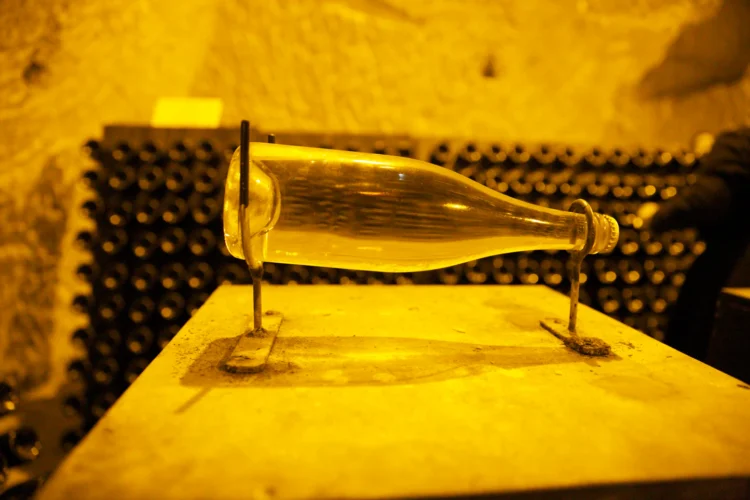 Why Does Champagne Age Better on Lees Than in Bottle Alone?